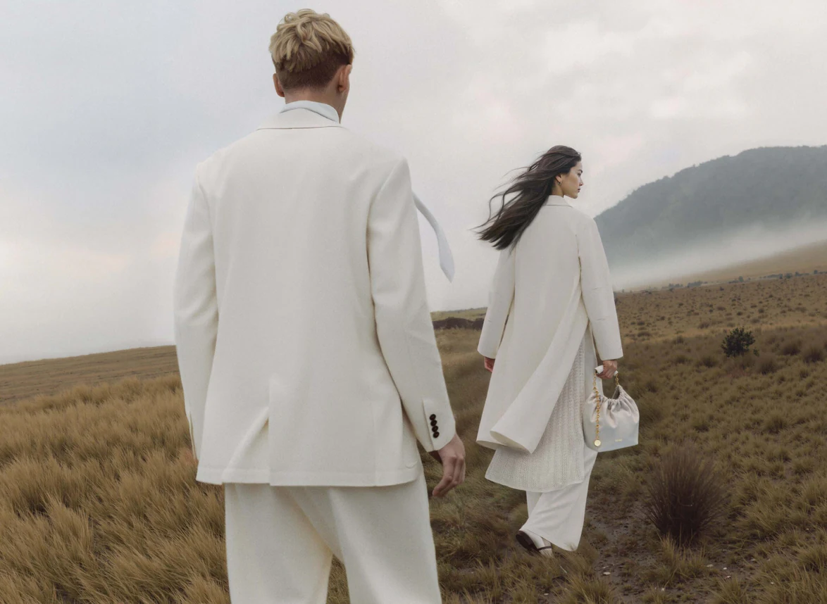 A frame from Scandinavian MIND’s Ground Zero editorial, produced with Genera.Space — two figures in white walking through a misty steppe